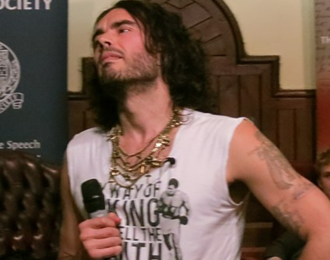 Russell Brand — anti-authority cultural figure, volatile public identity, born 1975, outer London