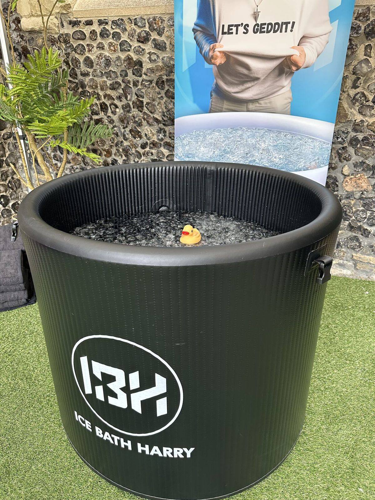 Close-up of the IBH ice bath, branded with Ice Bath Harry's logo and Let's Geddit tagline, Mental Wealth 2026