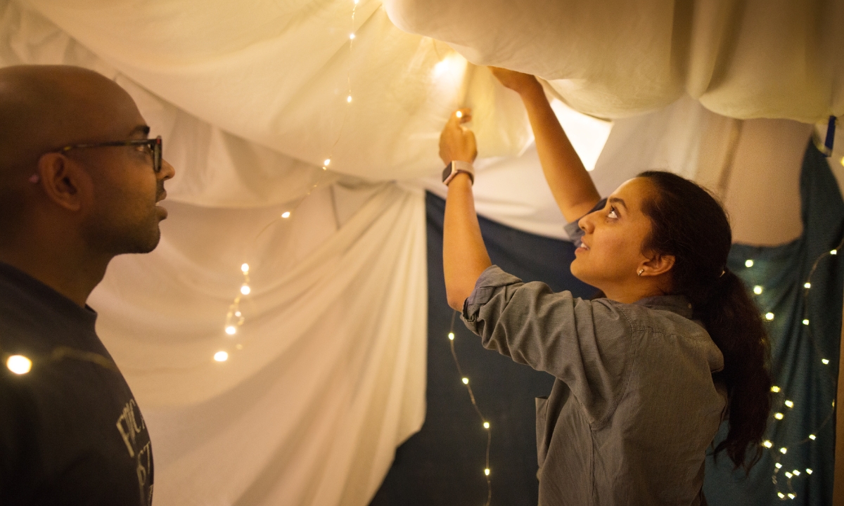 National Pillow Fort Championship — large-scale competitive pillow fort construction in progress